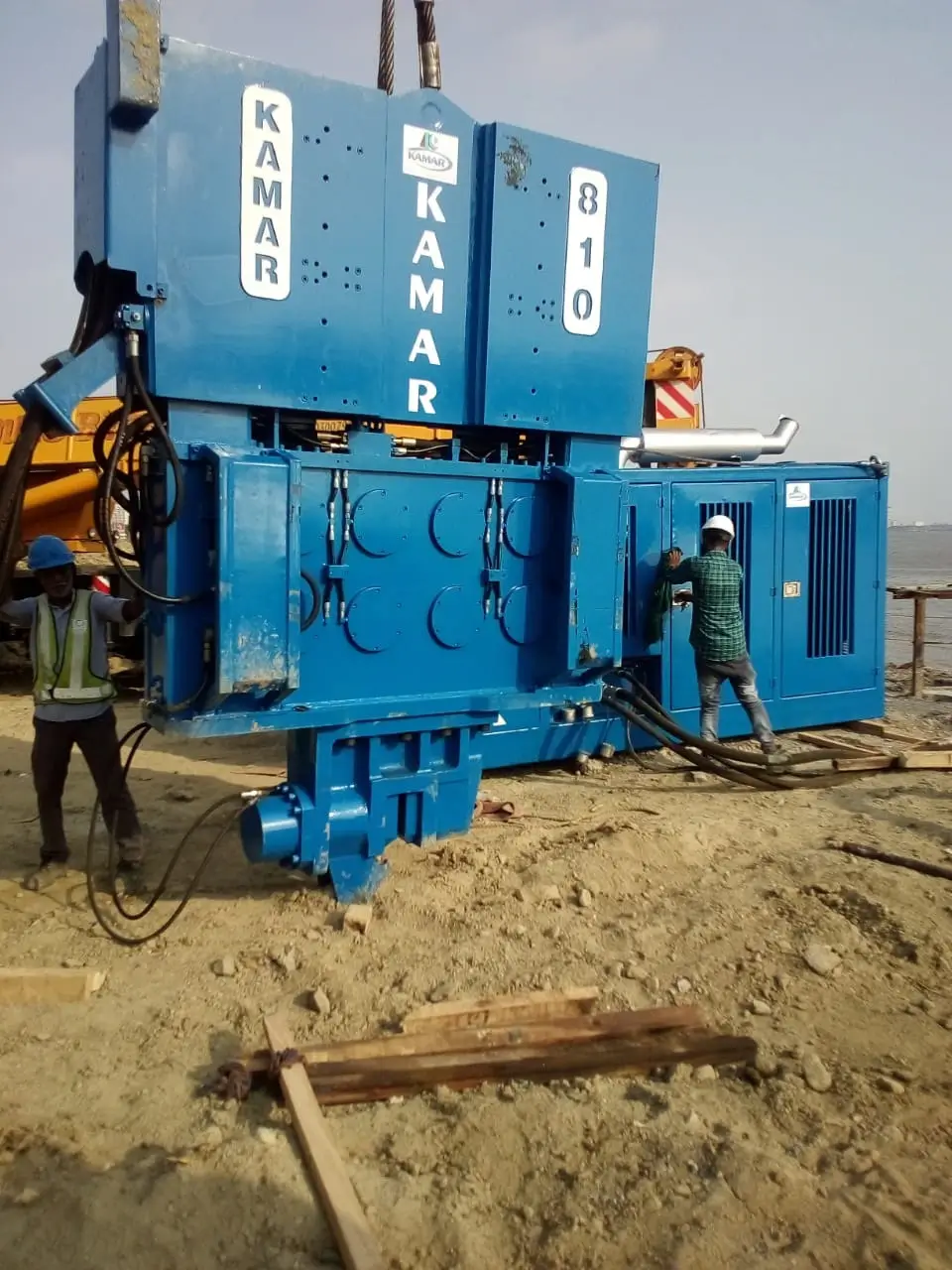 Man working on sheet piling machine